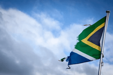 This is a photo of the South African Flag. They are south and therefore are in debt. Its ripped because it shows that Africa is in debt in a symbolic way.