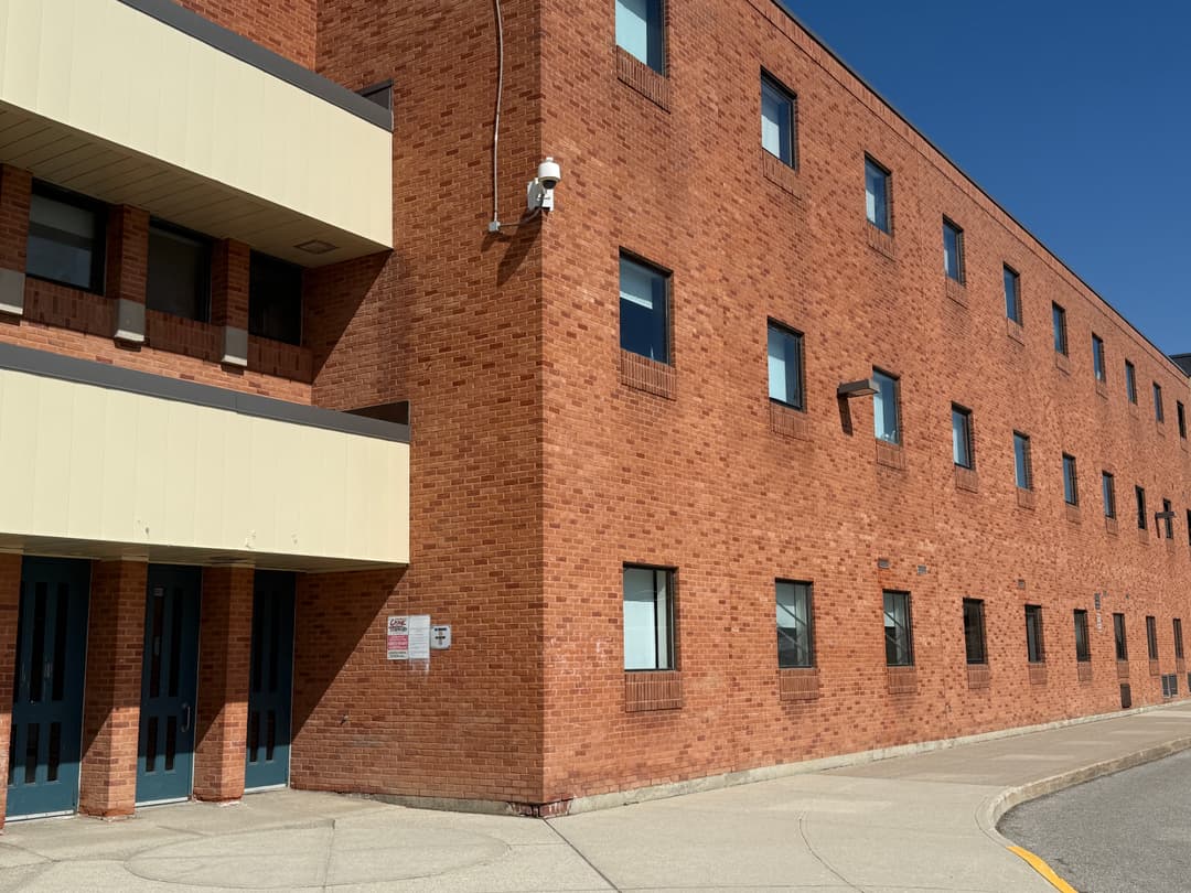 This is the front of our school, a very large and modern looking building with several stories. This shows two things one is that our school has a lot more funding which the other school would be able to have if the country wasn't in debt